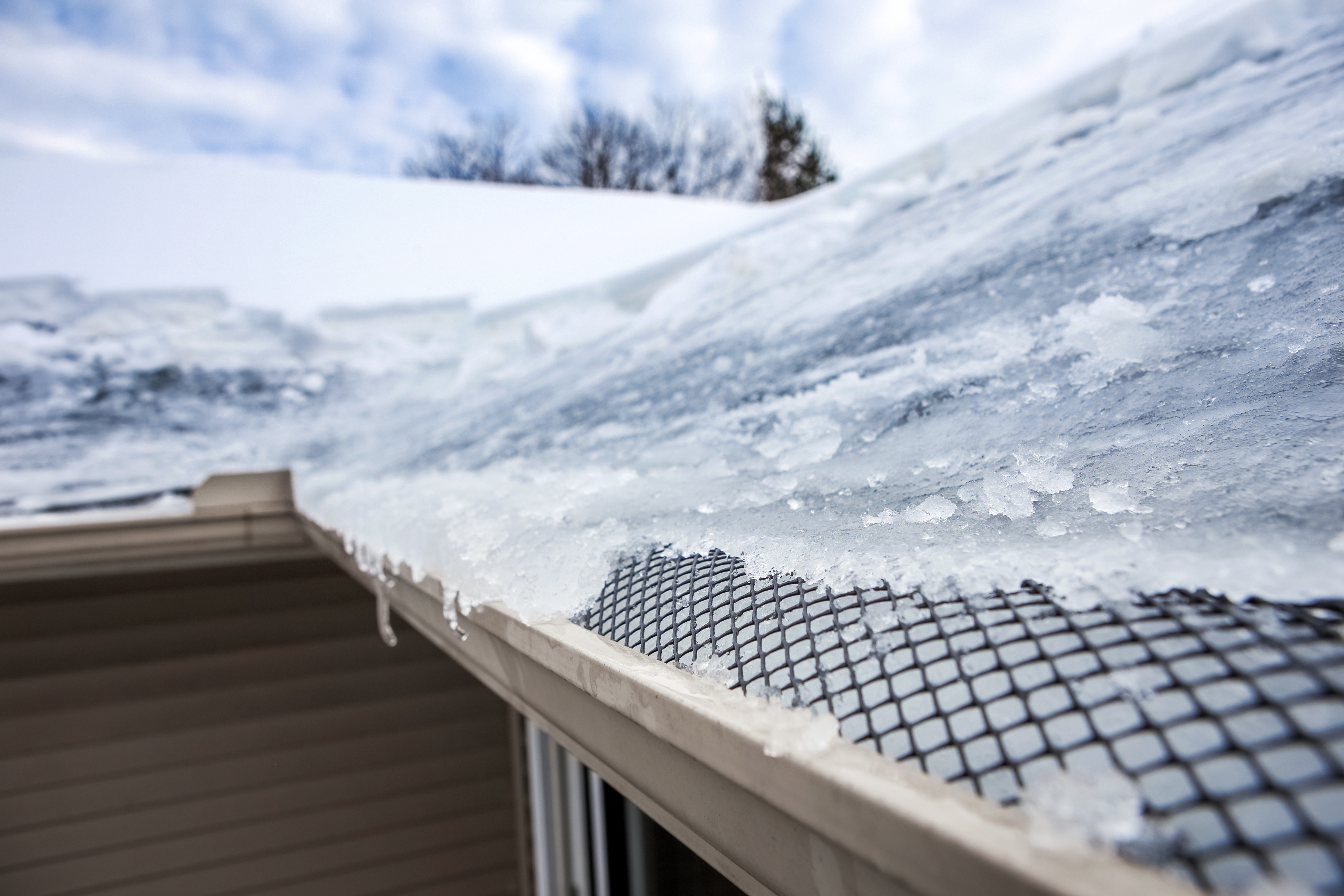 prevent ice dams with roof maintenance by Sela Roofing